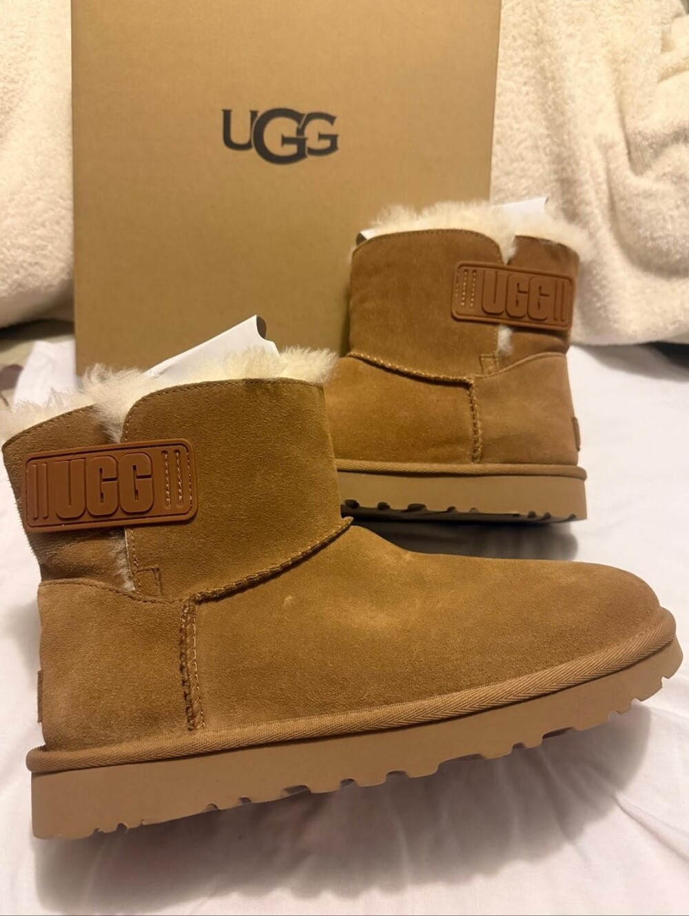 UGG Women Mini Bailey Logo Strap Suede Shearling Boot - Chestnut/Tan